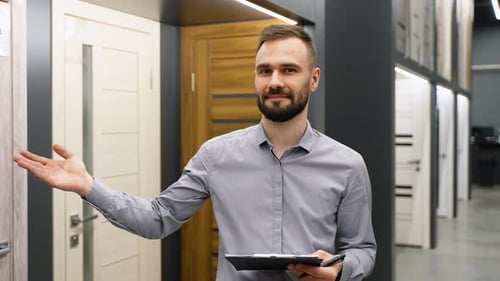 Seller with Clipboard in Doors Store