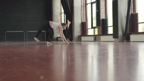 Young Woman Dancing Contemporary in Loft Dance Studio