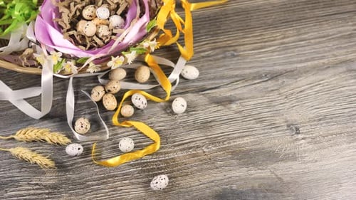 Eggs in Basket Decorated with Ribbons and Flowers Easter Celebration Concept