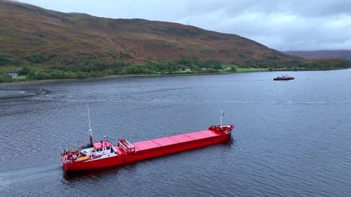 A Cargo Barge Moves Construction Equipment Aerial View
