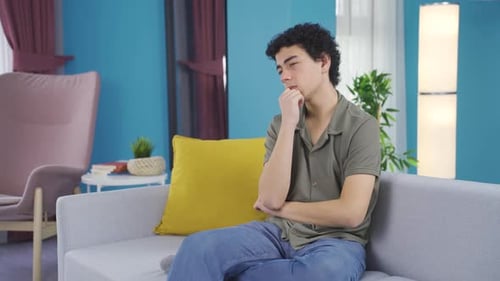 Thoughtful and stressed male adolescent height at home.