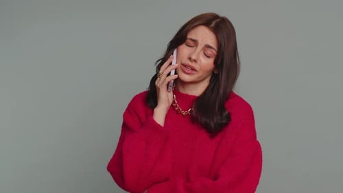 Woman Talking on Phone, Looking Worried