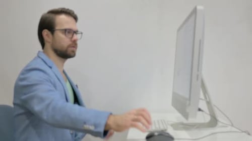 Middle Aged Man Coming to Office and Starting Work on Desktop
