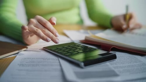 Close Up of Calculator on Top of Paperwork