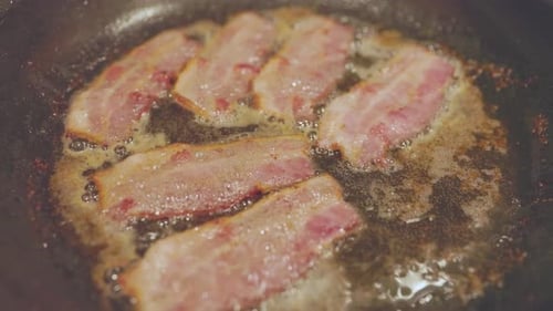 Bacon Sizzling In Pan While Cooking