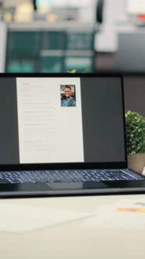 Vertical Video Empty Startup Space with a Laptop Running CV Applicant Before Job Interview