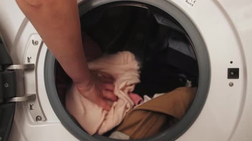 Clothes Spinning in Washing Machine in Close Up