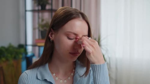 Closeup Portrait of Tired Woman Teacher Suffering From Tension Migaine Headache at Home Office