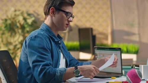 Eyeglasses Designer Showing Sketches to Colleague Closeup Man Declining Idea