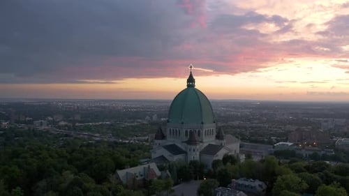 Drone flying around the spectacular Saint-Joseph oratory at dusk in Montreal, Quebec