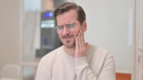 African Businessman Working on Laptop in Office