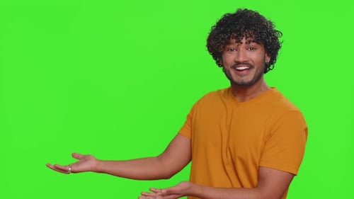 Indian Man Showing Thumbs Up Pointing Empty Place Advertising Area for Commercial Text Copy Space