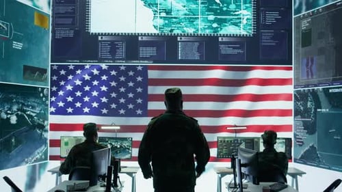 US Military Officer Supervising Threat Detection Activity in High Tech Office