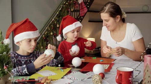 Festive Family Making Christmas Ornaments at Home
