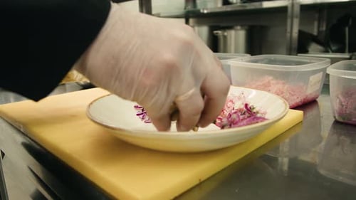 Chef Preparing Salad Dish in Restaurant Kitchen