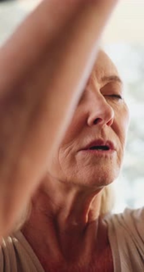 Old woman, namaste and meditation with yoga for wellness, breathing exercise or eyes closed at gym