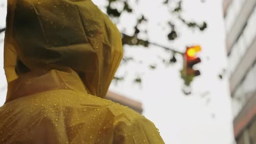 Business Man Tourist Person with Umbrella and Raincoat on Rainy European City Street Lights