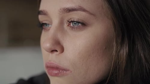 Close up of sad woman looking away. Shot with RED helium camera in 8K.