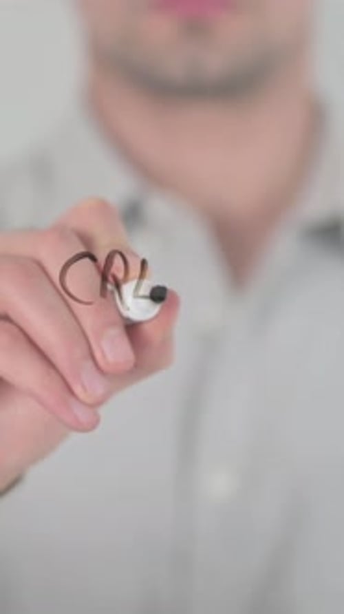 Man Writes Creative Process On Clear Surface