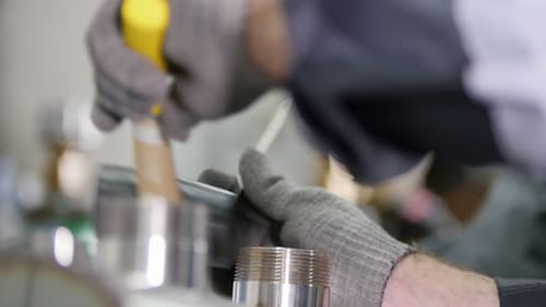 Industrial Factory Workers Measures the Length of the Detail and Fixing It