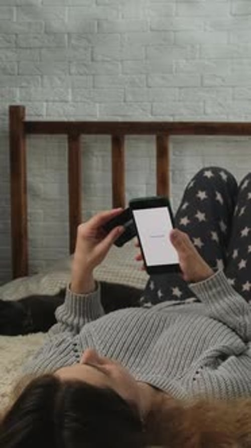 Vertical Video Making Online Payments with Mobile Phone and Bank Card at Home