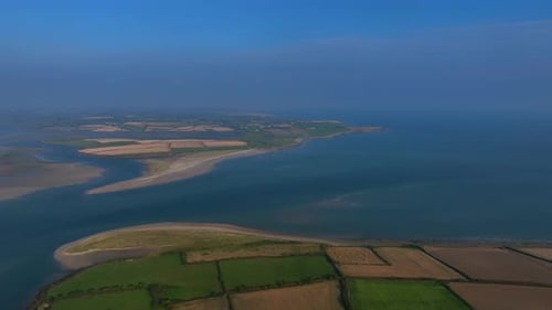 Saltmills, County Wexford, Ireland, September 2024. Drone wide panoramic orbit above Bannow Bay, sho