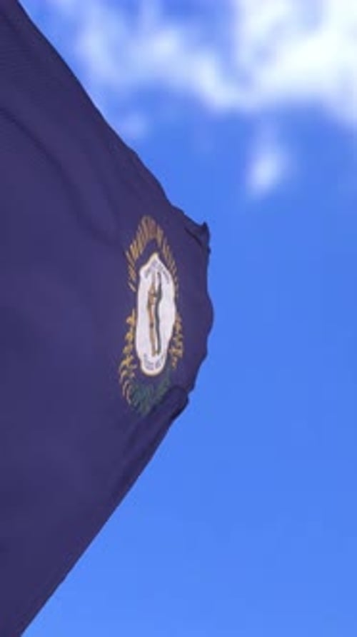 Waving Kentucky State Flag Against Blue Sky