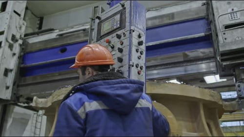 Worker with Control Panel for Automated Machines at Factory Stock Clip Specialists in Programming