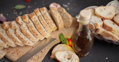 Appetizing Sliced Bread with Oil and Fresh Produce