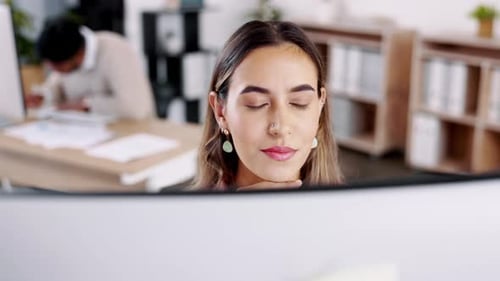 Young Woman Working at Computer in Modern Office