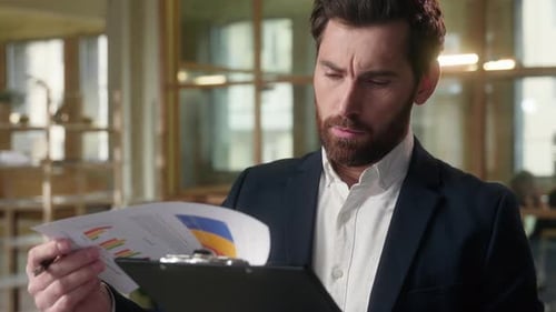 Displeased Business Man Pensive Male Businessman Thoughtful Reading Documents in Office Consider