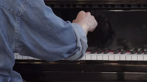 Hands Playing Piano Keys, Close Up