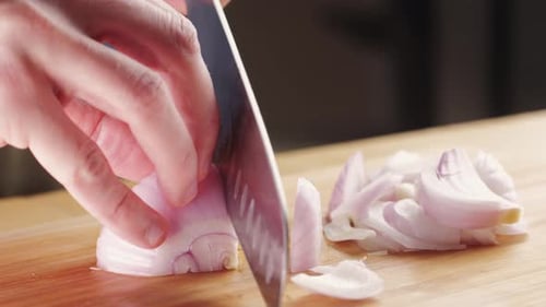 Chef Chopping a Red Onion with a Knife on the Cutting Board Macro Close Up of Cutting Red Onion on
