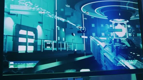 Close-up Shot of the Computer Screen with First-Person Shooter Online Video Game Gameplay in Progre
