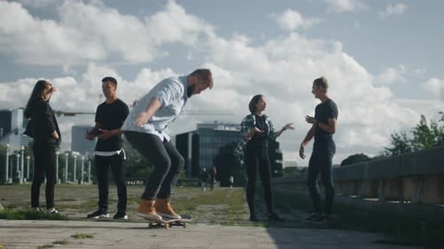 Young Adults Skateboarding and Hanging Out in City