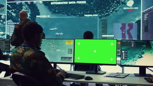 Military Personnel Working in a Futuristic Control Room