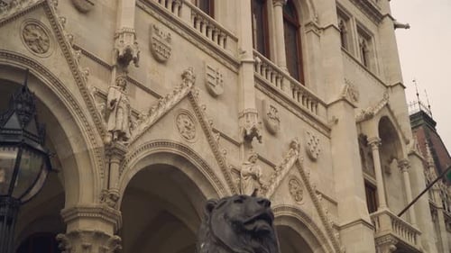 Bronze Lion Statue In The Entrance Of The Hungarian Parliament Building In Budapest - tilted medium