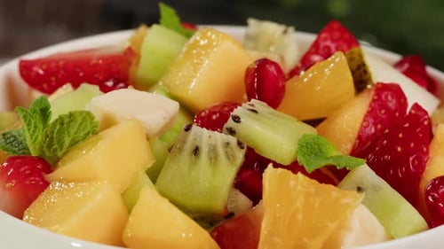 Fresh Fruit Salad in White Bowl Close Up