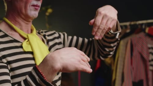 Man in Costume with Makeup Gesturing with Hands