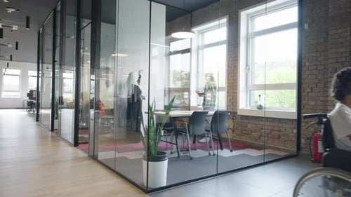 Modern Open Office with Young Adults Working