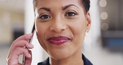 Smiling Woman Talking on a Smartphone
