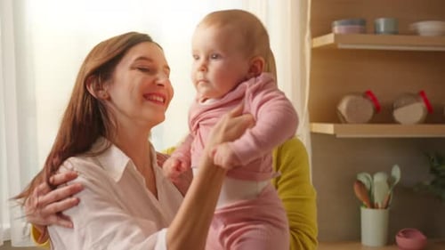 Loving Family Embraces with Baby Indoors