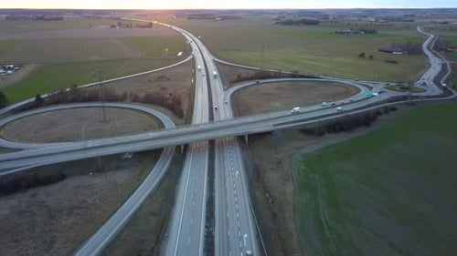 Aerial View of Freeway Intersection with Moving Traffic Cars