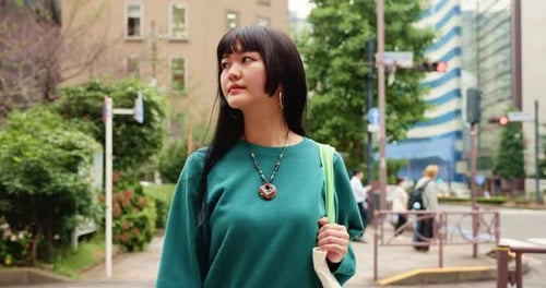 City, thinking and walking with pedestrian woman outdoor for holiday, travel or vacation abroad