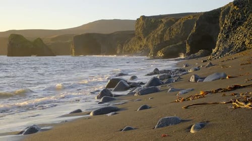 Coastline with Volcanic Mountains and Black Sand Beach at Sunrise Sea Nature Sunny Golden Weather