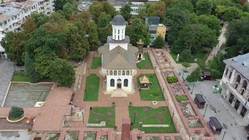 Zoom in shot of a orthodox church in the middle of the city