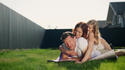 Family Enjoys Time Together in Sunny Backyard