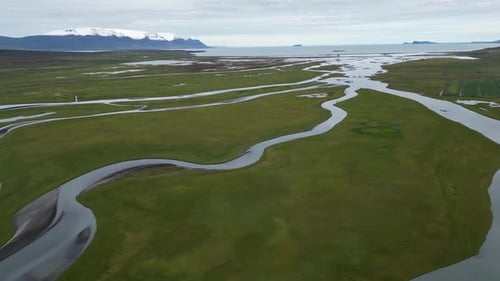 Breathtaking Aerial View of a River Running Through the Arctic Tundra in Iceland
