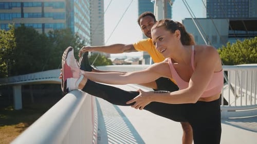 Adults Leg Stretching Exercise on Bridge in City