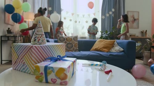 Kids Celebrate at a Birthday Party with Gifts